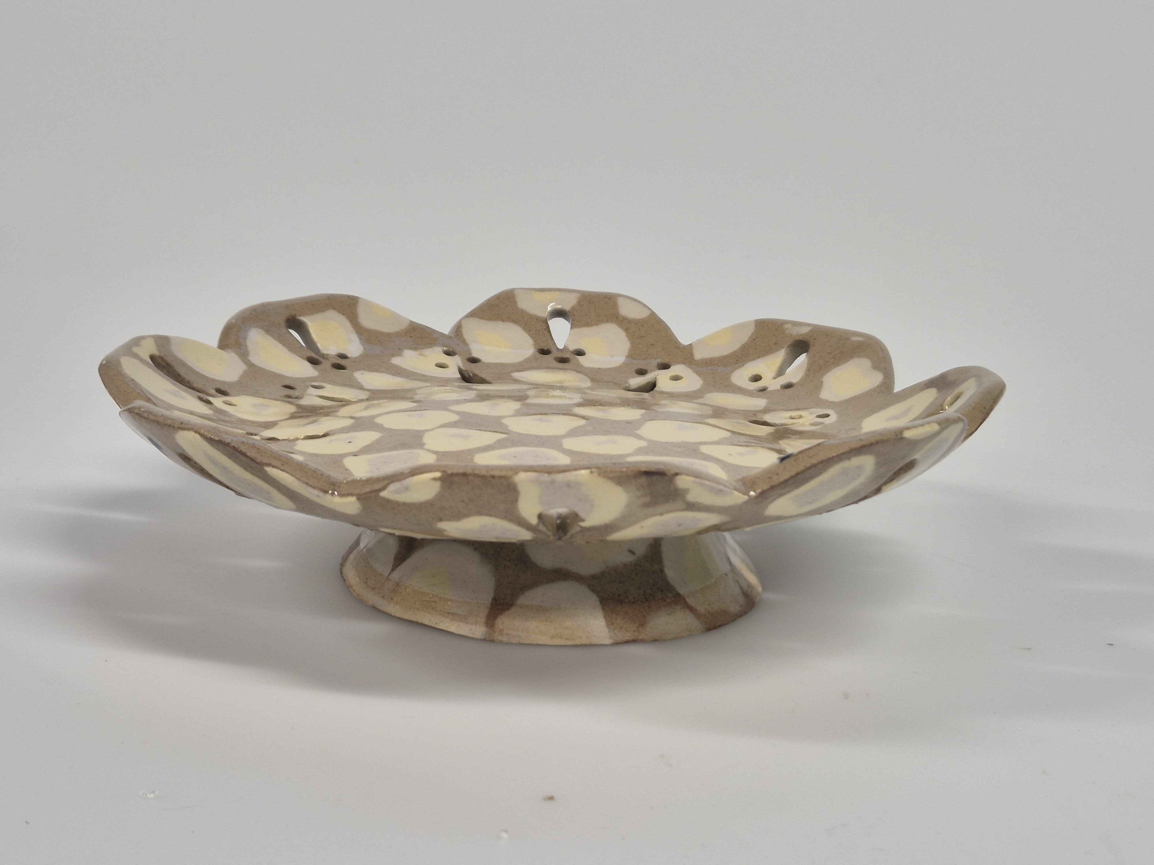side view of egg pattern flat bowl